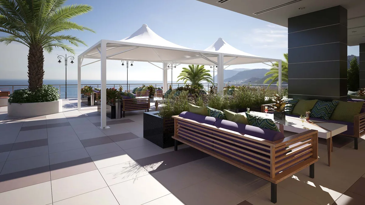 Gazebo bianchi su terrazza con salotto e palme